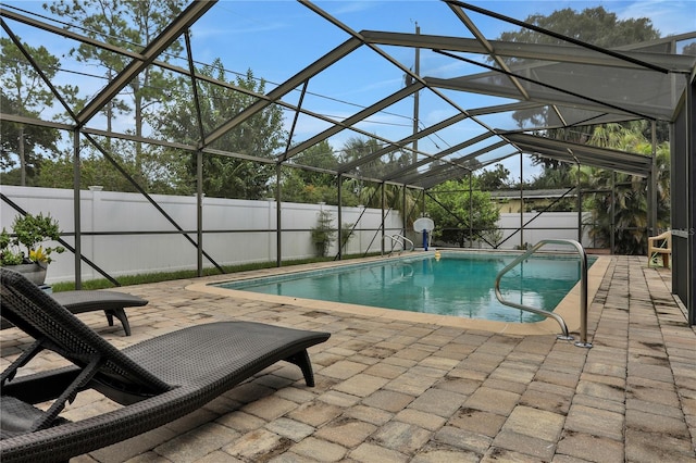 view of pool featuring a lanai and a patio area