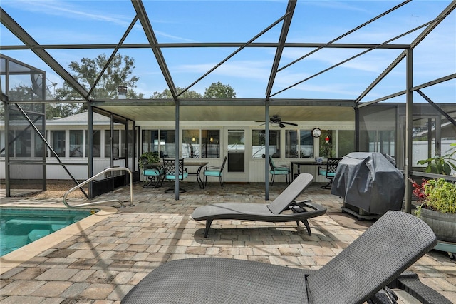 view of patio / terrace featuring ceiling fan, grilling area, and a lanai