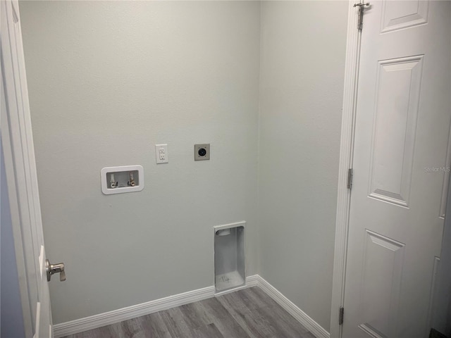 washroom with light hardwood / wood-style flooring, hookup for an electric dryer, and hookup for a washing machine