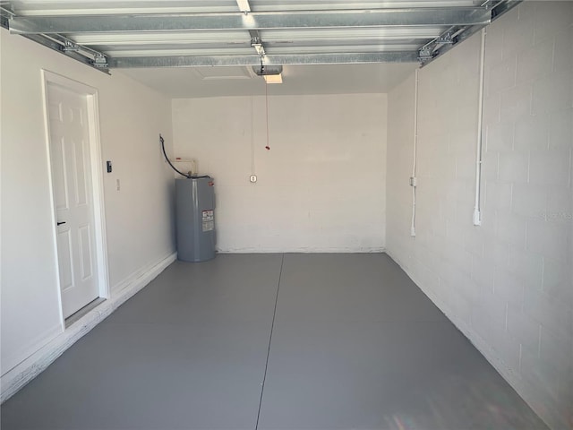 garage featuring water heater and a garage door opener