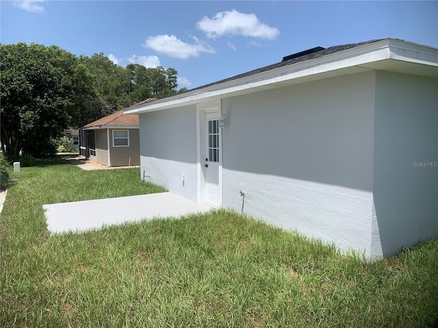 view of home's exterior with a yard