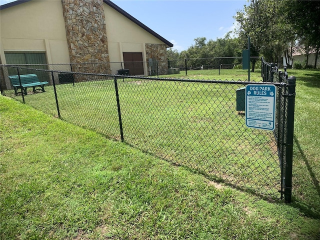 view of home's community with a yard