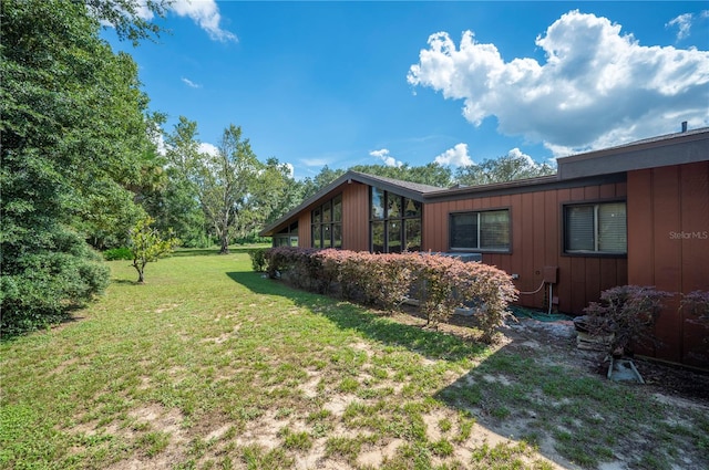 view of property exterior featuring a yard