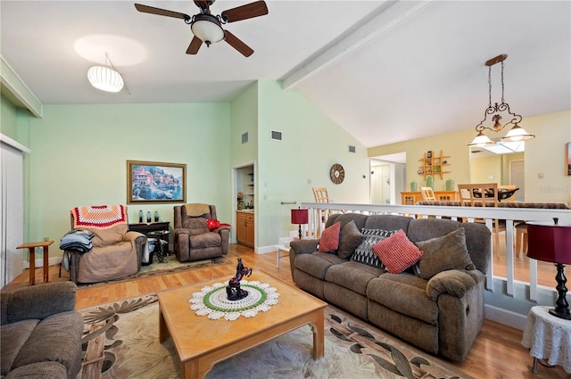 living room featuring vaulted ceiling with beams, ceiling fan, and light hardwood / wood-style flooring