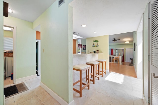 hallway with light tile patterned floors