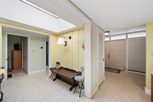 mudroom with light tile patterned flooring