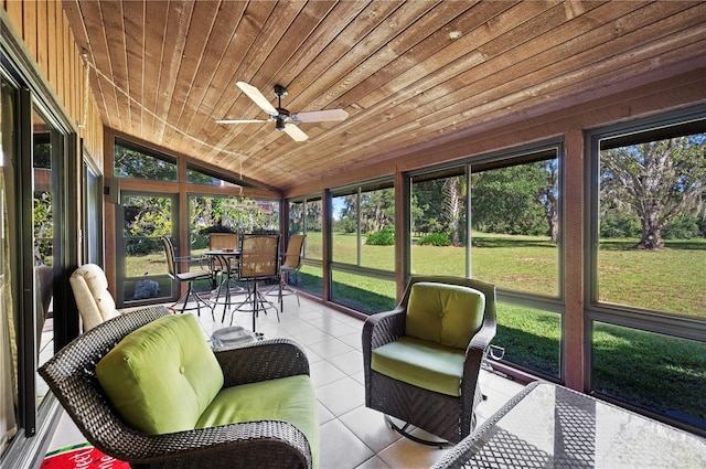 unfurnished sunroom with ceiling fan, lofted ceiling, and wooden ceiling