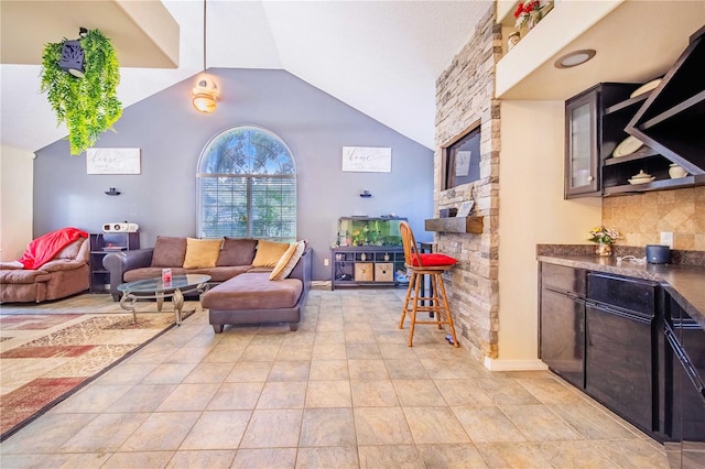 living room with high vaulted ceiling