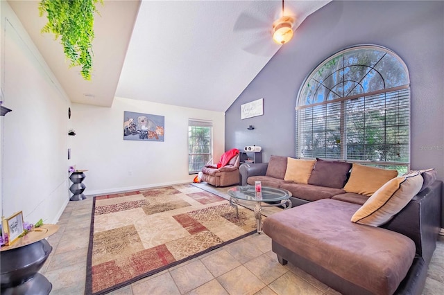 living room featuring high vaulted ceiling and ceiling fan