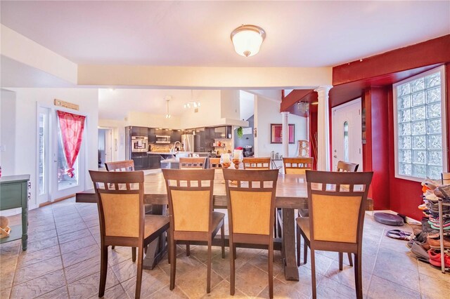 34415 Kingfish St, Fruitland Park, FL 34731 - dining room with ornate columns and stone tile flooring