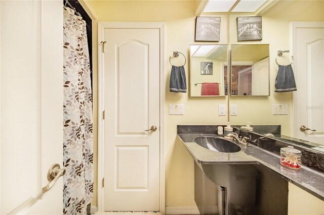 34415 Kingfish St, Fruitland Park, FL 34731 - full bathroom with vanity and a shower with shower curtain