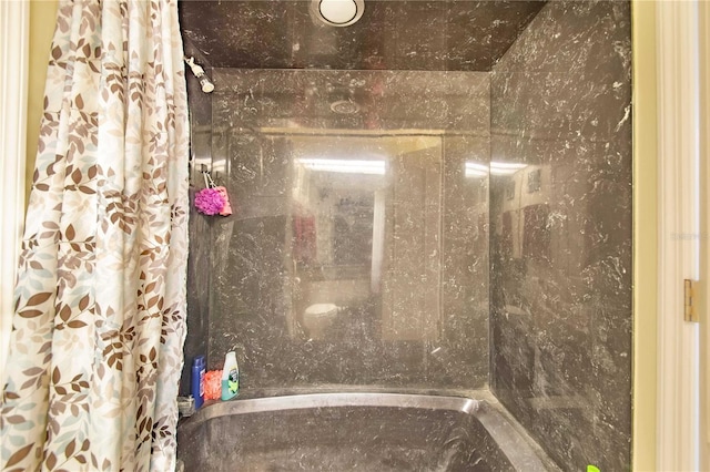 bathroom featuring walk in shower