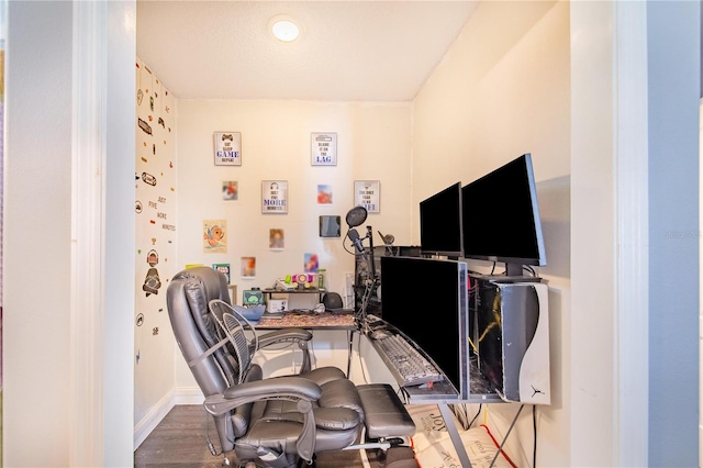 office with dark hardwood / wood-style floors