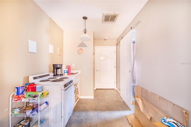 kitchen featuring electric range, washer / clothes dryer, decorative light fixtures, light tile patterned floors, and a textured ceiling