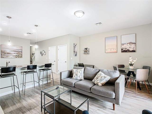 living room with light hardwood / wood-style floors