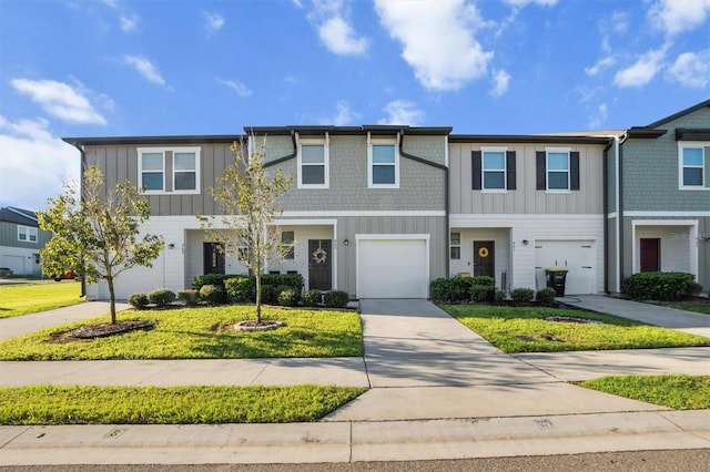 view of property featuring a garage and a front yard