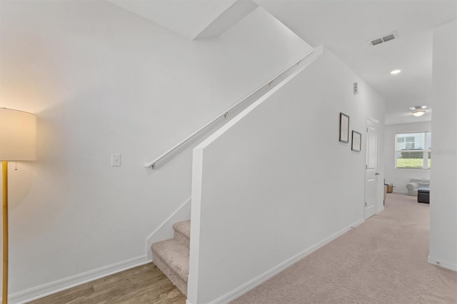 staircase with carpet flooring