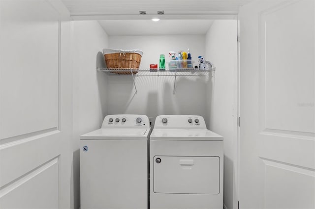 clothes washing area featuring washing machine and dryer