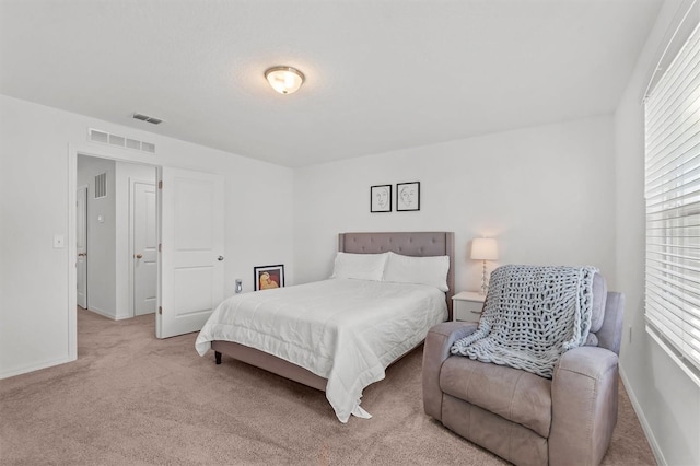 bedroom with light carpet