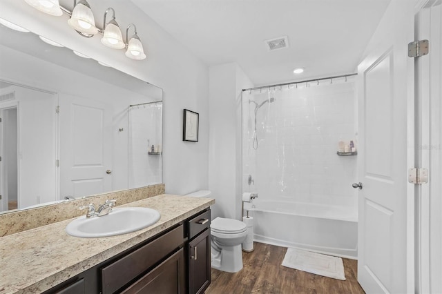 full bathroom featuring vanity, shower / bath combo with shower curtain, toilet, and hardwood / wood-style flooring