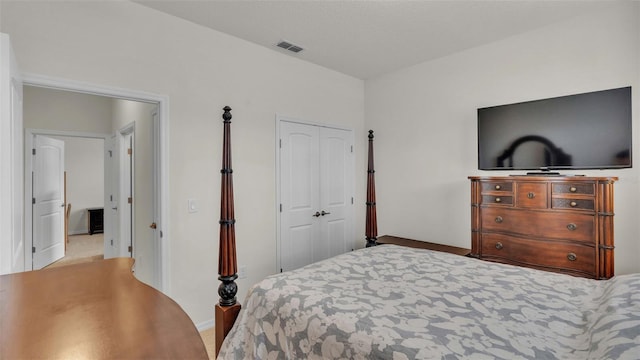 carpeted bedroom with a closet