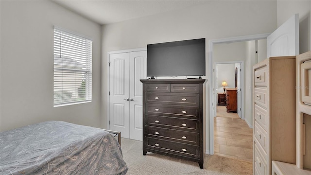 carpeted bedroom featuring a closet