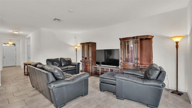 living room featuring light tile patterned flooring