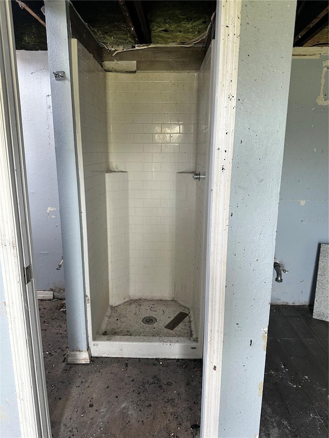 bathroom with tiled shower