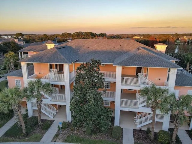 view of outdoor building at dusk