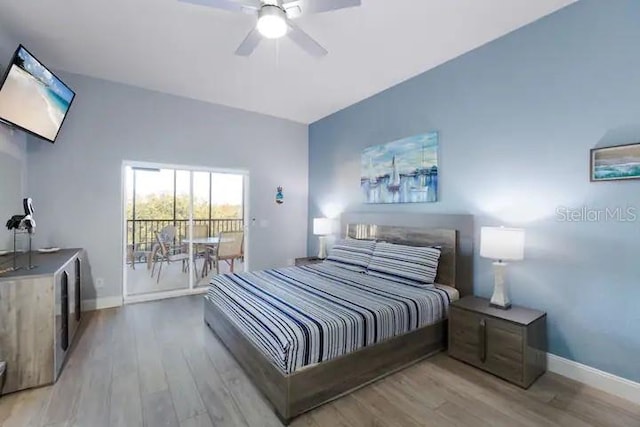 bedroom featuring light hardwood / wood-style floors, ceiling fan, and access to exterior