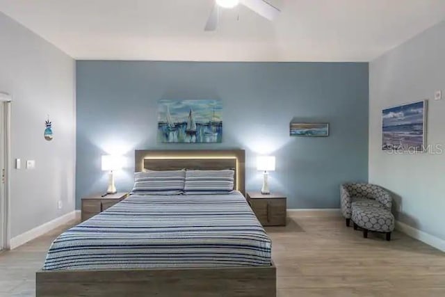 bedroom with light wood-type flooring and ceiling fan