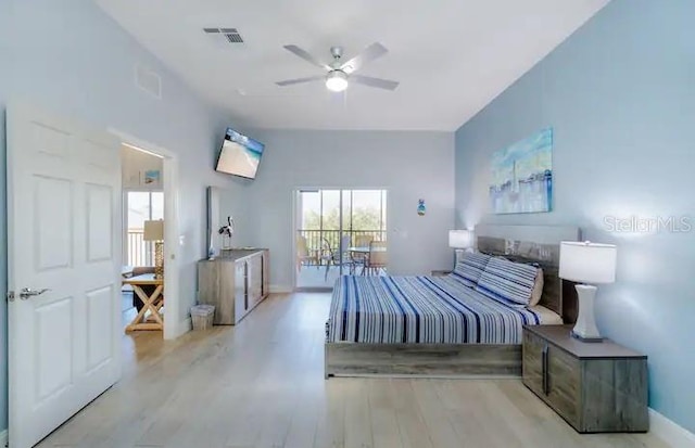 bedroom with light hardwood / wood-style floors and ceiling fan