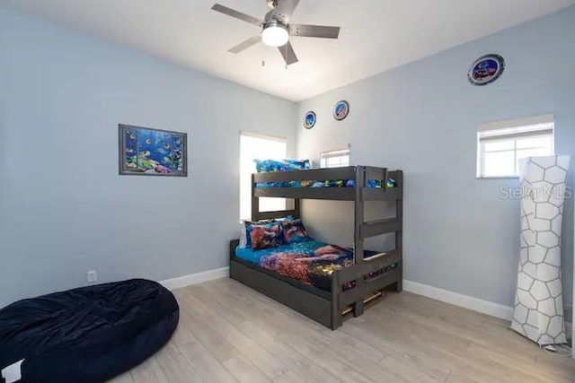 bedroom featuring light hardwood / wood-style floors and ceiling fan