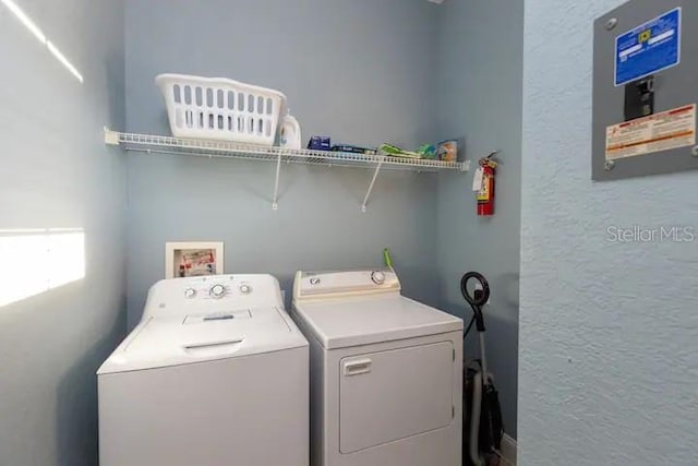 washroom with separate washer and dryer