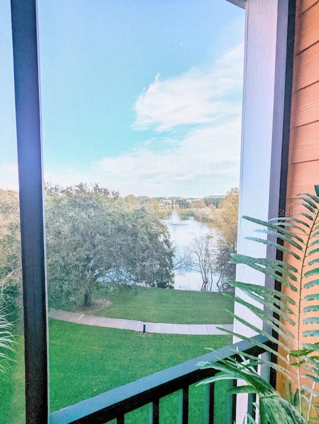 balcony featuring a water view