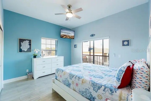 bedroom featuring access to outside, light hardwood / wood-style floors, and ceiling fan