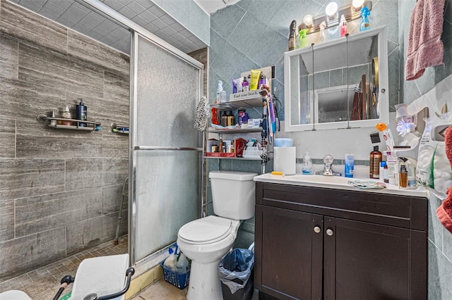 bathroom with vanity, an enclosed shower, and toilet