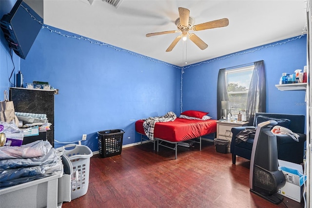 bedroom featuring ceiling fan and dark wood-type flooring