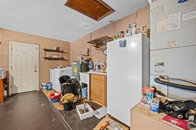 kitchen with white fridge and washing machine and clothes dryer