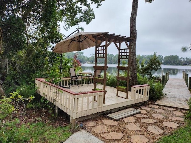 deck featuring a water view and a boat dock