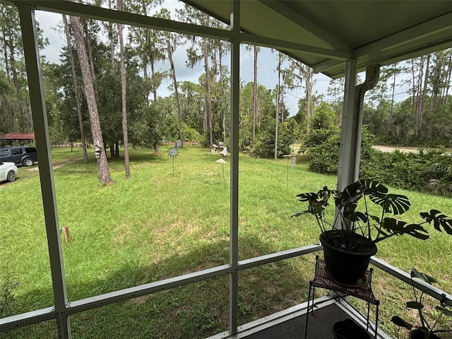 unfurnished sunroom with lofted ceiling and a healthy amount of sunlight