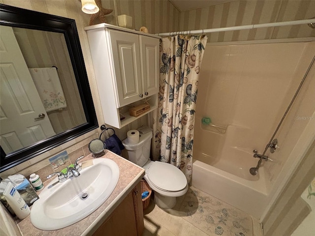 full bathroom with tile patterned floors, toilet, shower / bath combo with shower curtain, backsplash, and vanity