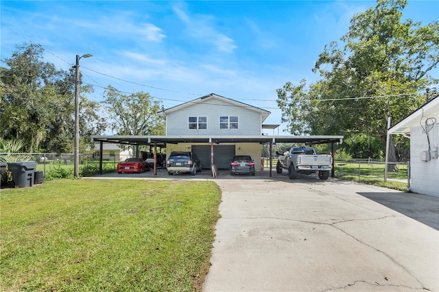 view of parking featuring a carport and a lawn