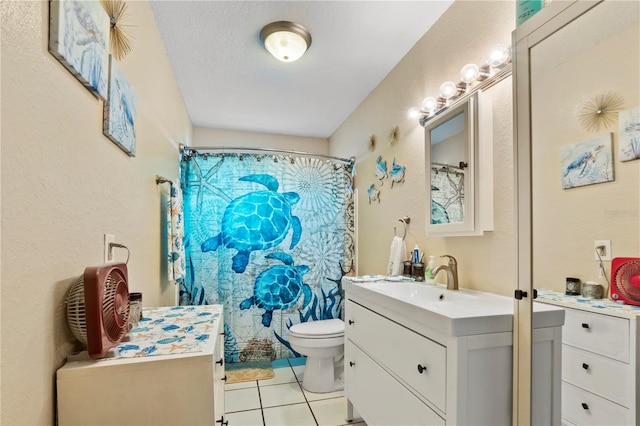 bathroom featuring vanity, a textured ceiling, tile patterned floors, toilet, and a shower with shower curtain