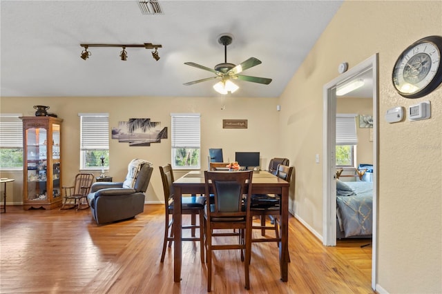 dining area featuring light wood-type flooring, a healthy amount of sunlight, and ceiling fan