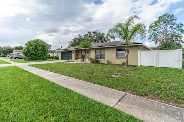 single story home with a garage and a front lawn