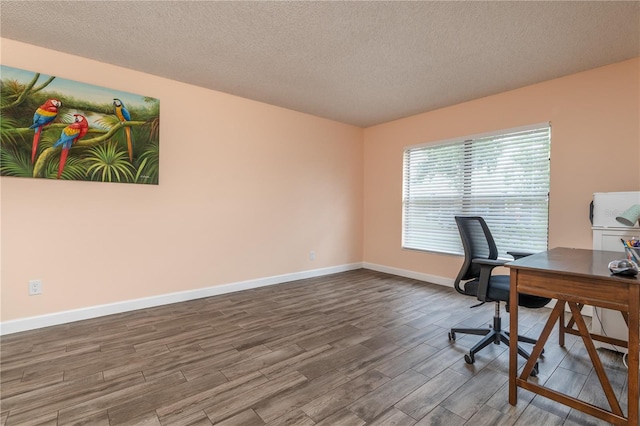 office area featuring a textured ceiling and hardwood / wood-style flooring