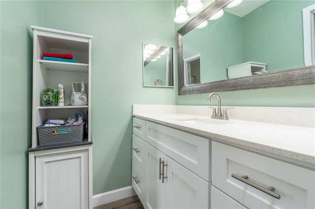 bathroom featuring vanity and wood-type flooring