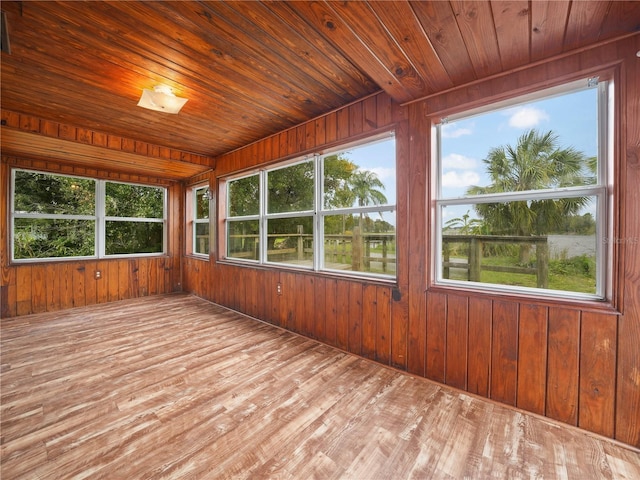 unfurnished sunroom with wooden ceiling