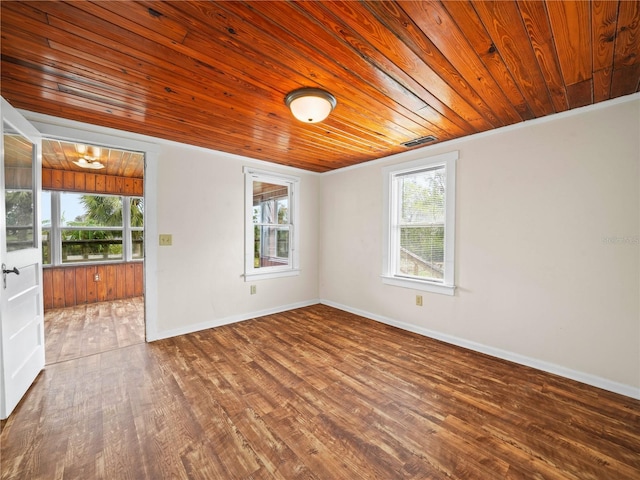 spare room with wood ceiling, wood-type flooring, and ornamental molding